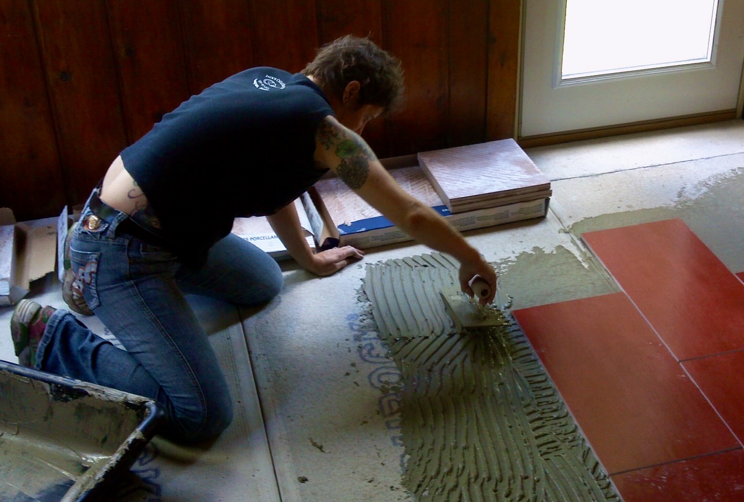Celeste tiling woman tiling a floor