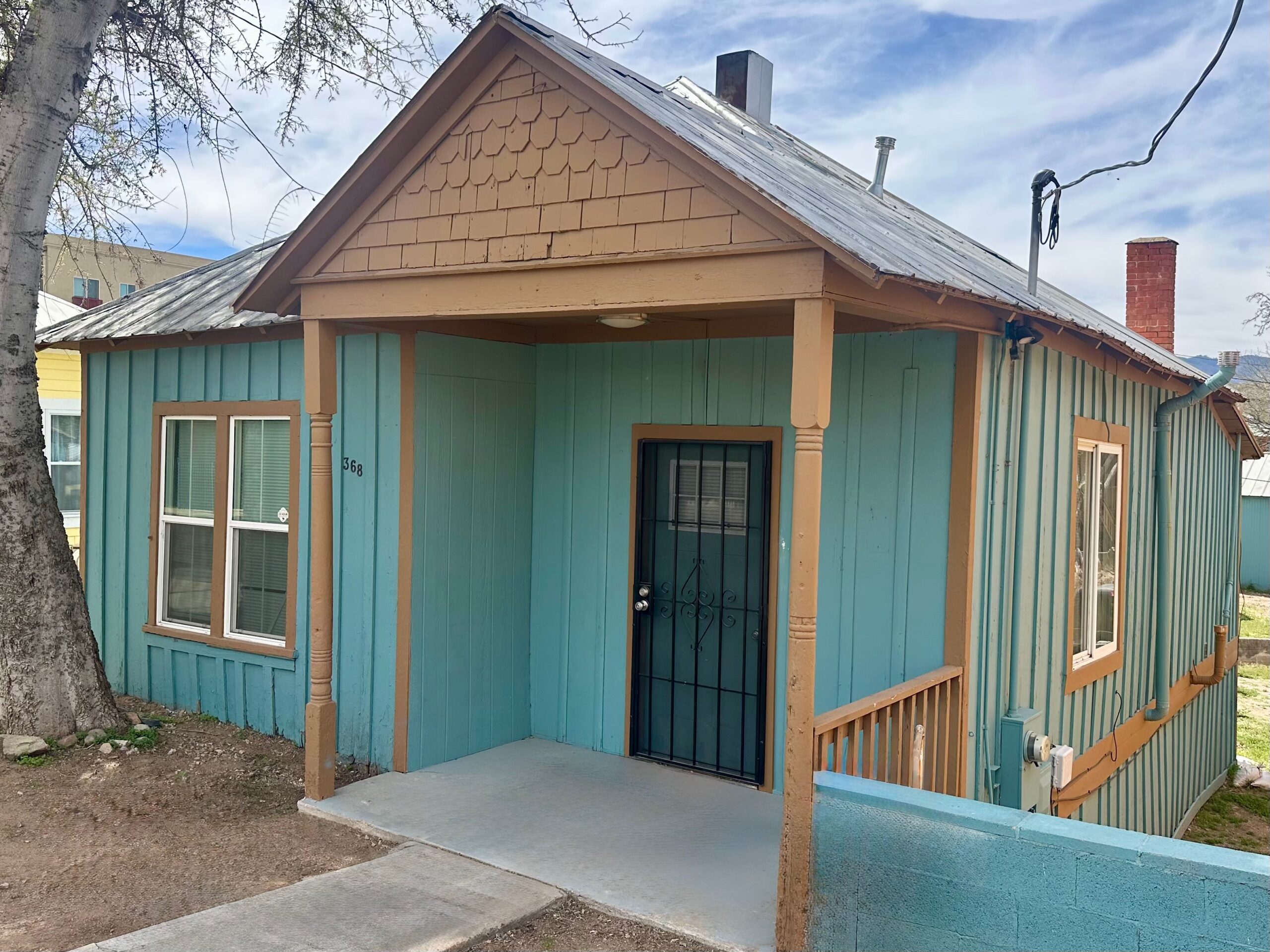 Front of a small teal house